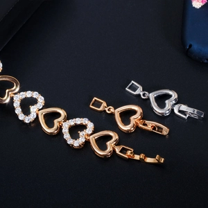 Hollow heart zircon bracelet in gold, silver, and rose gold with polished metal finish