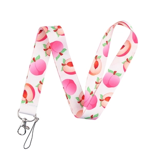Detailed view of pink peach fruit pattern lanyard with durable metal swivel hook