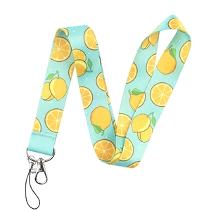 Detail of light blue lanyard featuring yellow lemon patterns and sturdy metal lobster clasp