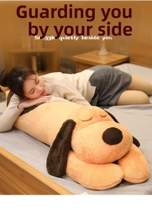 Cute long plush dog sleeping pillow in orange fabric with soft embroidered eyes on a bed