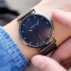 Macro shot of Geneva men's quartz watch with dark brown mesh strap and minimalist dial
