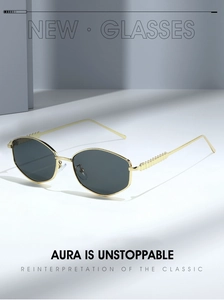 Close-up of golden metal frame sunglasses with 3D wave texture temples and grey lenses