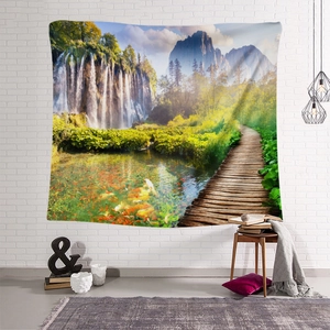 Detailed view of bohemian waterfall tapestry featuring lush forest and mountain scenery