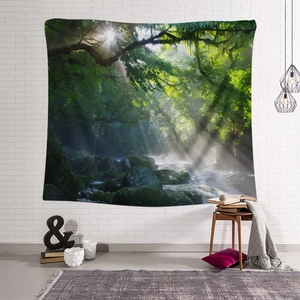 Detailed view of forest landscape tapestry hanging on a white brick wall in a cozy room