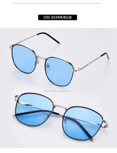 Detail view of square silver metal sunglasses with transparent blue lenses and model C05 info