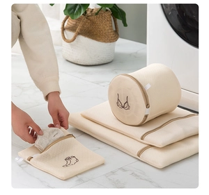 Close-up of laundry mesh bags with bra and sock embroidery for organized washing protection