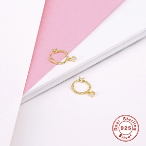 Detailed macro view of S925 sterling silver beaded gold hoop earrings with square zircon