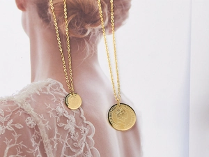 Detail of 18K gold-plated Elizabeth II coin pendant necklace with a fine O-link chain