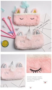 Detail of plush unicorn pencil case with sequin horn and embroidered eyelashes