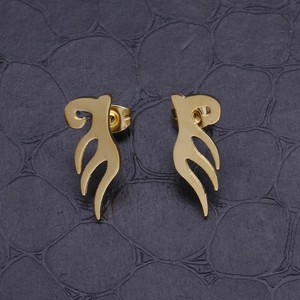 Minimalist golden angel wing stud earrings for women on a black textured surface