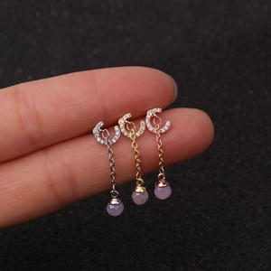 Three surgical steel earrings in silver, gold, and rose gold with pink zircon drop beads