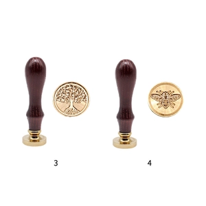 Solid brass wax seal stamp with wooden handle featuring tree of life and bee designs