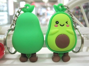 Detailed view of cute cartoon avocado keychains made of soft silicone material