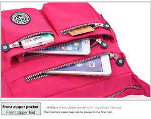 Detail view of multi-pocket rose pink nylon bag showing layered storage for gadgets