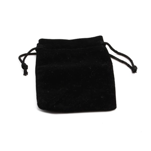 Detail of a soft black velvet drawstring pouch for secure jewelry storage and packaging