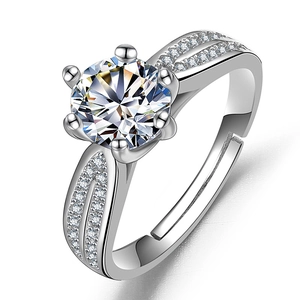 Close-up of a silver zircon ring with six-prong setting and side micro-pave detailing