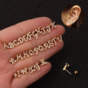 Golden 26 alphabet earrings with cubic zirconia and secure screw back closure