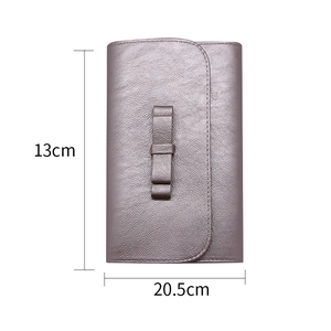 Detailed view of lilac makeup brush organizer with bow detail and size dimensions