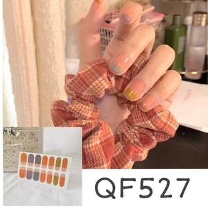 Macro detail of waterproof peach polka dot nail wraps with glossy jelly finish QF527