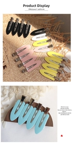 Macro view of colorful seamless duckbill hair clips set for makeup hair styling