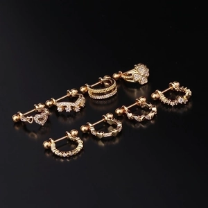 Golden stainless steel cartilage studs set with cubic zirconia and screw ball backs