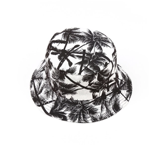Reversible bucket hat with black and white palm tree print for sun protection