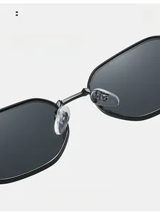 Detail of soft silicone nose pads and metal bridge on square frame sunglasses