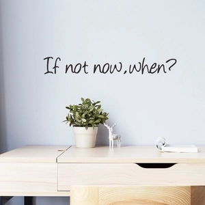Inspirational 'If not now, when?' wall decal on a blue wall above a wooden desk decoration