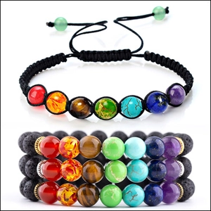 Detail of 7 chakra natural stone bead bracelets with black lava rock and woven cord