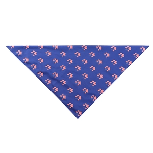 Detail view of triangular pet bandana with red, white and blue American flag paw prints
