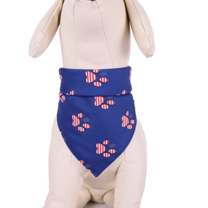 Detail of pet bandana featuring USA flag heart paw print on navy blue fabric