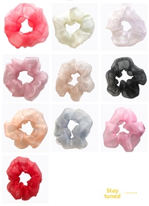 Macro display of lightweight organza scrunchies in ten various pastel colors