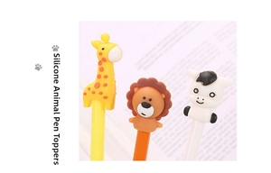 Detail of cute silicone animal toppers featuring giraffe, lion, and zebra on pens