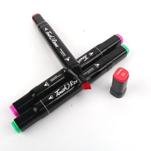 Detail of TouchRaven twin markers showing the broad chisel tip in red carmine ink