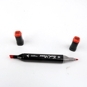 Detail view of dual-tip marker showing broad and fine nibs with color code 22 French Vermilion