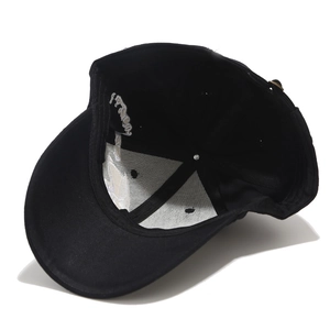 Black baseball cap with skull embroidery shown from an interior perspective with back strap