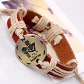 Detail of retro leather bracelet with bronze Aquarius zodiac charm and woven rope accents