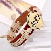 Detail of Libra zodiac vintage woven leather bracelet with bronze metal charm