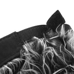 Detail of adjustable velcro strap and textured grey synthetic hair on baseball cap