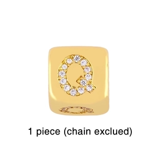Detailed view of a gold-plated square pendant featuring a sparkling Zirconia Q letter