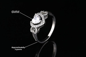 Detail of 6mm heart-cut zircon ring with hollow twisted silver band weighing 3g