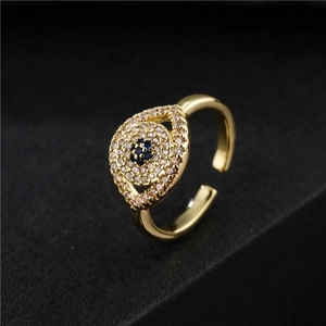Classic golden evil eye open ring with pave white zircons and blue center stone