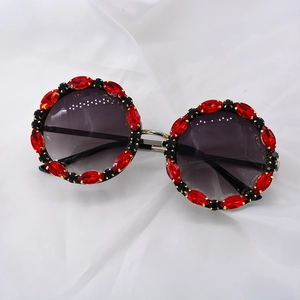 Oversized round sunglasses with red crystal rhinestones and dark grey lenses for women