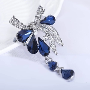 Broche nœud vintage avec cristaux bleus en forme de goutte et strass brillants
