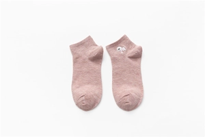 Detail view of pink cotton ankle socks featuring cute bear embroidery on the cuff