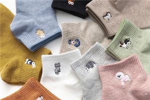 Detailed view of colorful cotton crew socks featuring cute animal embroidery patterns