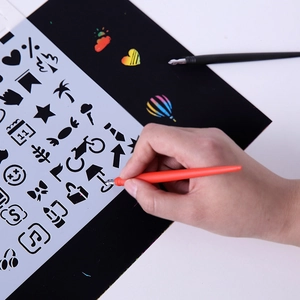 Rainbow scratch art set with orange stylus, white stencils and black scratch paper