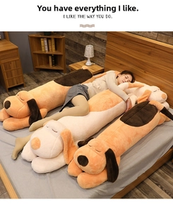 Extra long plush dog pillow showing soft texture in a cozy bedroom setting