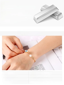 Détail du bracelet œil protecteur doré avec perle de nacre et acier inoxydable 316L