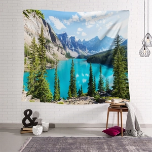 Detail of mountain lake scenery tapestry hanging on a white brick wall in a cozy room